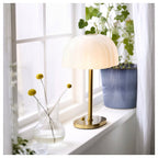 AKTERSPRING
Table lamp, opal white glass/brass-plated