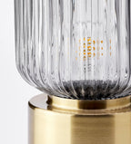 SOLKLINT
Table lamp, brass/grey clear glass