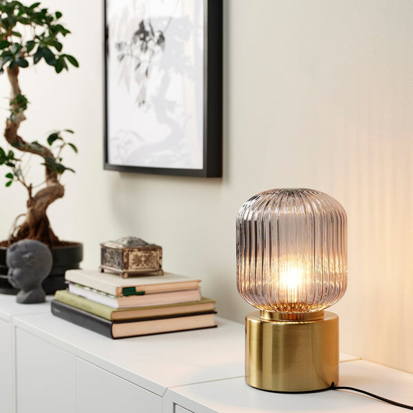 SOLKLINT
Table lamp, brass/grey clear glass
