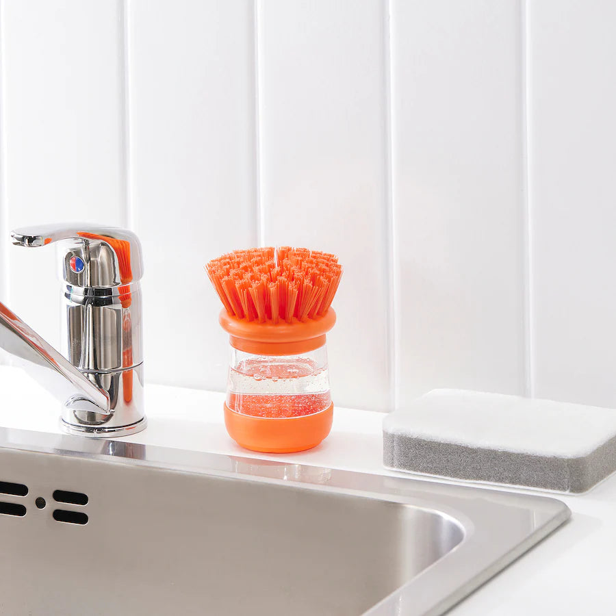 VIDEVECKMAL dish washing brush 

Dish-washing brush with dispenser, bright green/orange