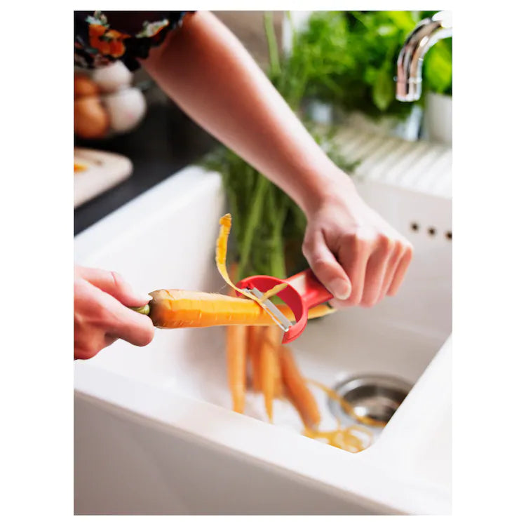 STÄM

Peeler, red, white/black.