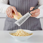 STRÅLANDE

Grater with handle, stainless steel/dark grey